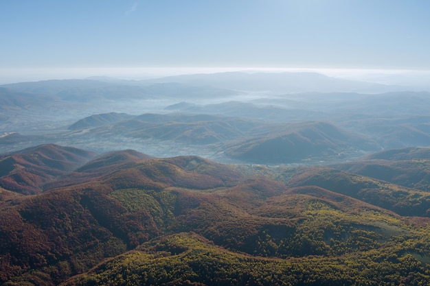 Beautiful landscapes of high mountains in warm autumn in the Carpathians peaks rural meadows countryside