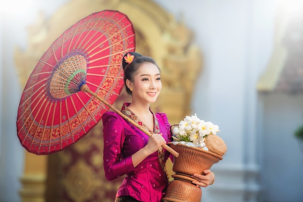 Beautiful Laos girl in Laos traditional costume, vintage style at Vientiane, Laos. 