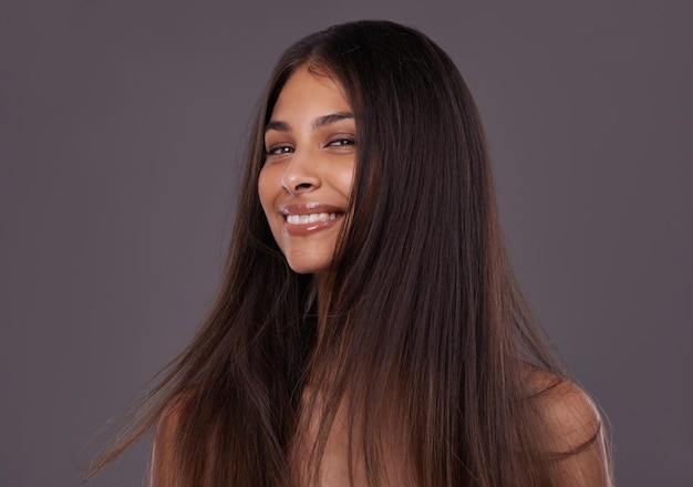 Beautiful laughter Cropped shot of a beautiful young woman posing in the studio