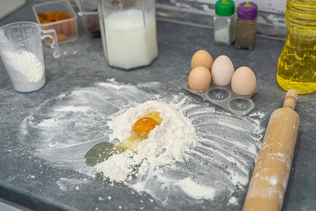 Beautiful layout of cooking with flour eggs oil and milk on the table Cooking concept