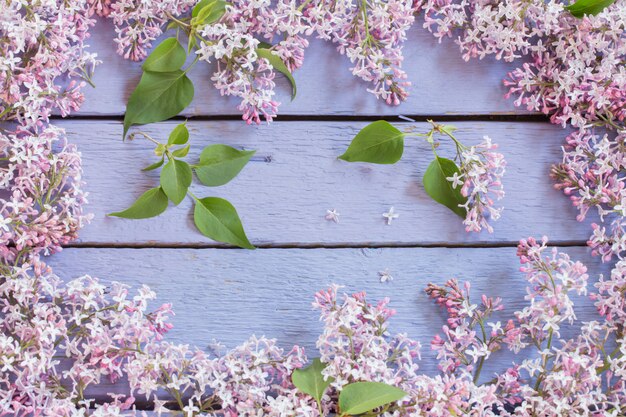 Beautiful lilac on a wooden background