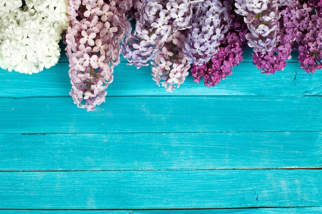 The beautiful lilac on a wooden background. 