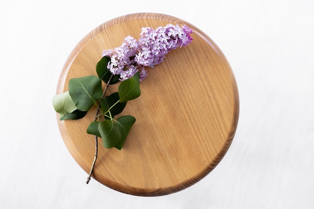 The beautiful lilac on a wooden background