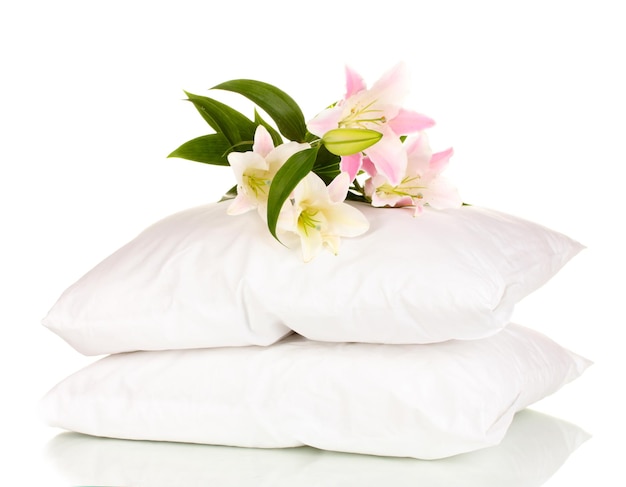 Beautiful lily on pillows isolated on white