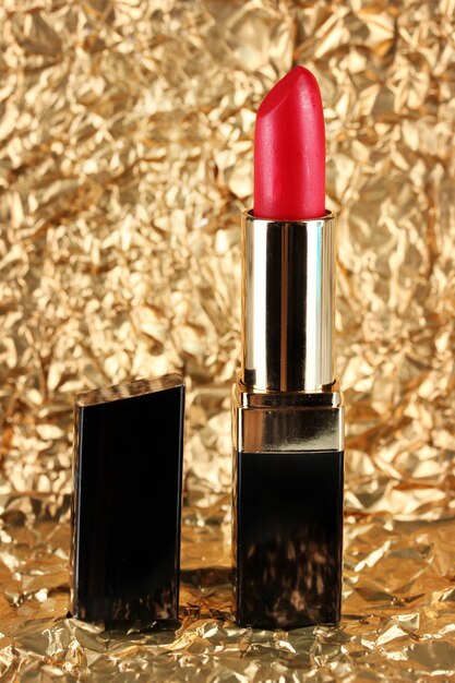 Beautiful lipstick on golden background