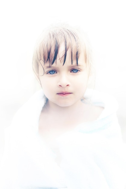 A beautiful little angel girl with fathomless blue eyes Portrait of an innocent child