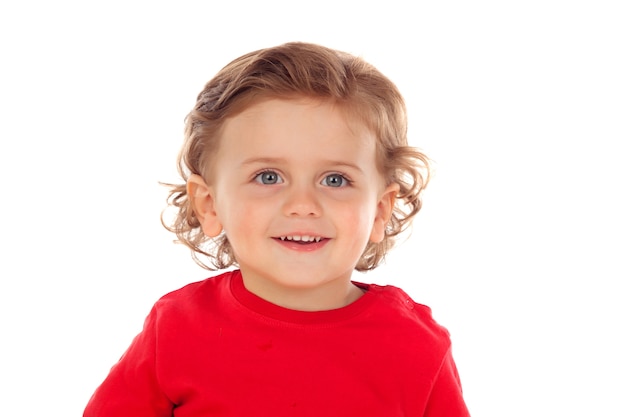 빨간 유니폼 미소와 함께 두 살 아름다운 작은 아이