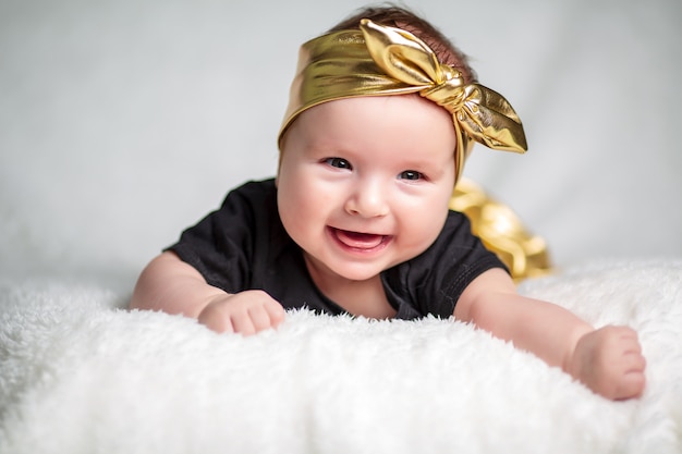 Beautiful, little girl in a black T-shirt.