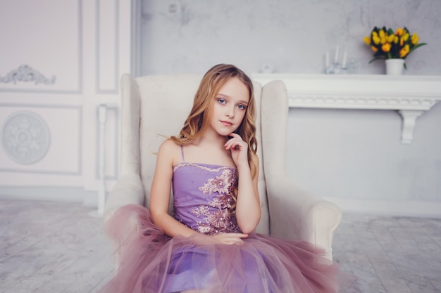 Beautiful little girl in a chic dress