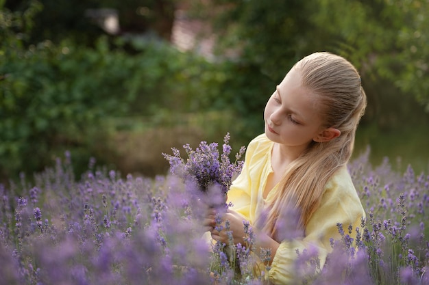 Beautiful little girl on lavender field