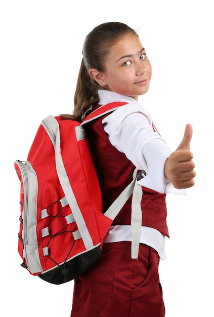 Bella bambina in uniforme scolastica isolata su white