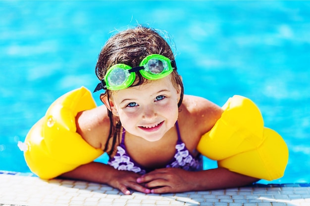 Beautiful little girl sunning at the pool