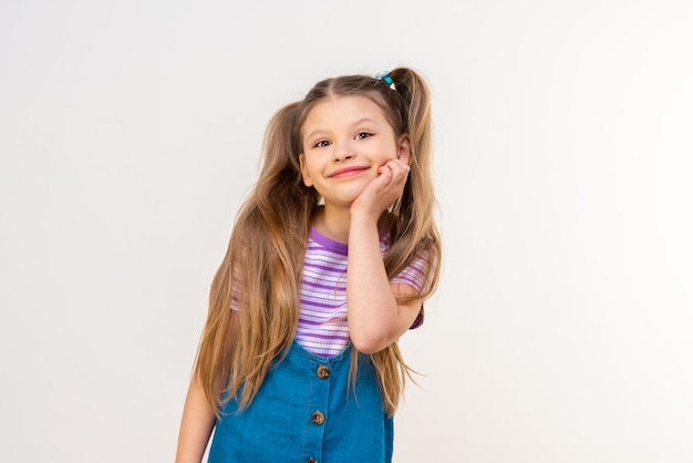 Beautiful little girl on a white isolated background.