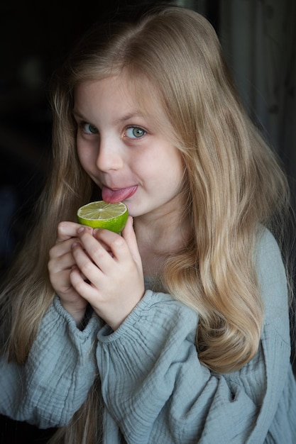 Beautiful little girl with lime