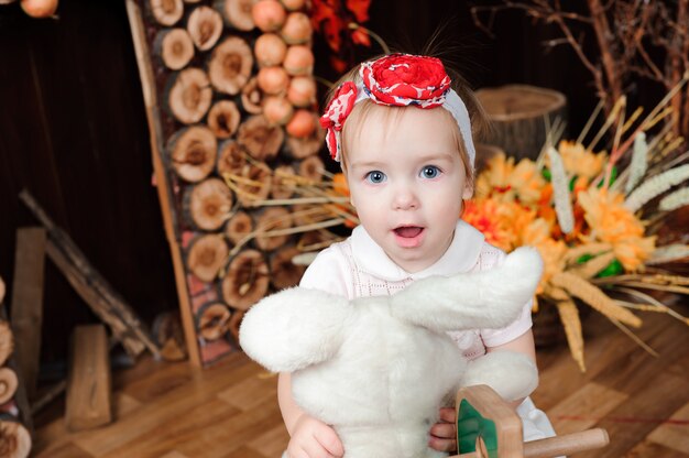 Beautiful little girl with toy smiling