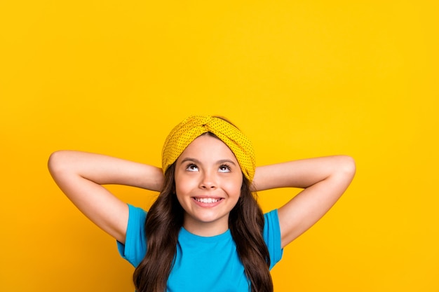 beautiful little lady hold arms behind head look up empty space