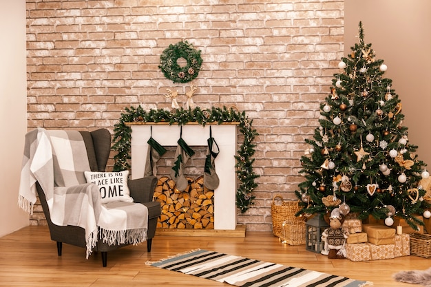 Beautiful living room interior with burning fireplace and Christmas tree