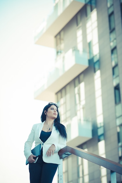 beautiful long black hair elegant business woman with tablet