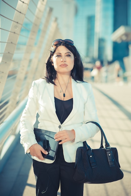 beautiful long black hair elegant business woman with tablet