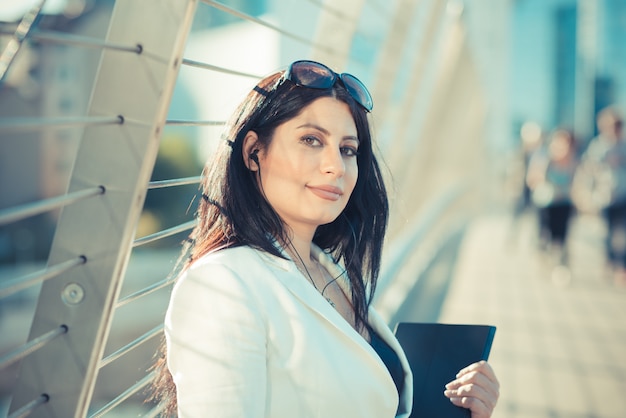 beautiful long black hair elegant business woman with tablet