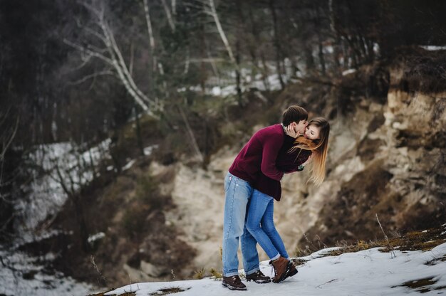 Beautiful loving couple posing in winter