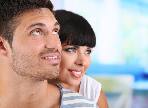 Beautiful loving couple together on bright background