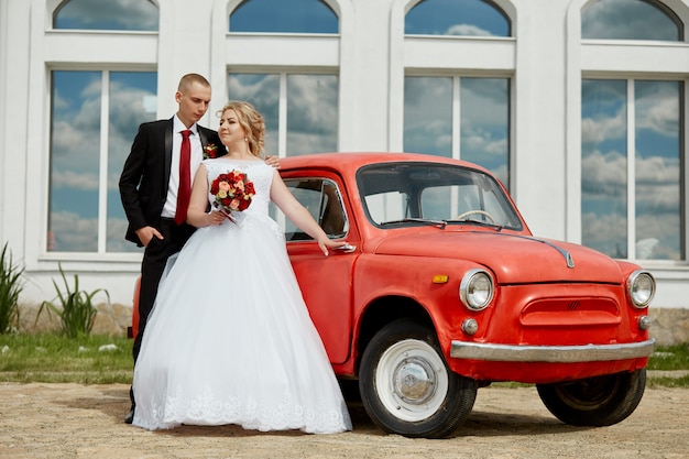 Photo beautiful loving wedding couple registers a marriage and walks along the beautiful promenade