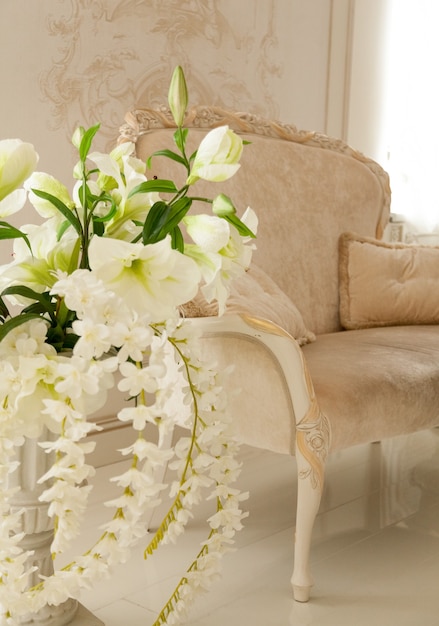 Beautiful luxury living room decorated by white flowers