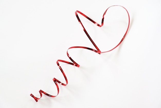 Beautiful luxury red heart shape from wire ribbon on white background use for valentines day