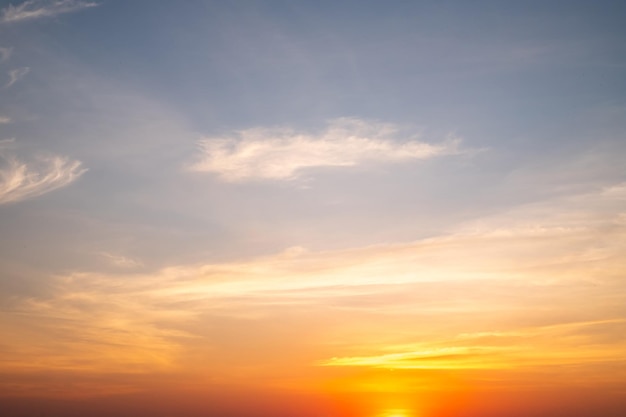 Beautiful of luxury soft gradient orange gold clouds and sunlight on the blue sky perfect for the background take in everningTwilight