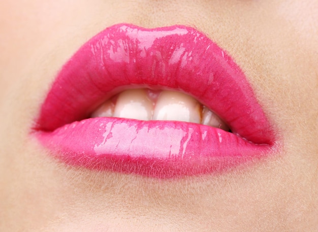 Beautiful make up of glamour pink gloss lips