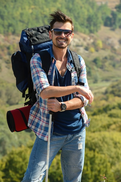 Beautiful man hiking outdoors leading a healthy lifestyle.