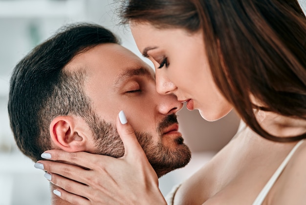 The beautiful man and woman kissing