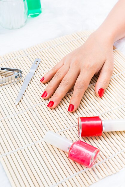 Beautiful manicured woman's nails with red nail polish