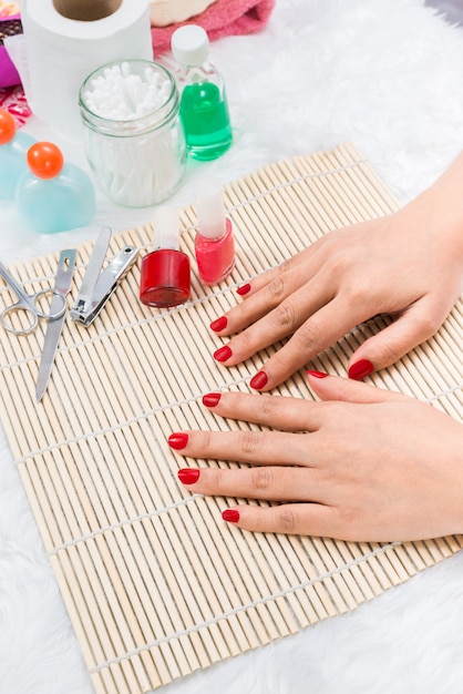 Beautiful manicured woman's nails with red nail polish