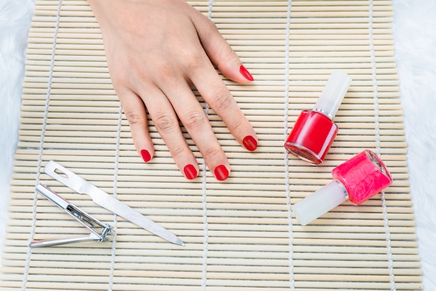 Beautiful manicured woman's nails with red nail polish