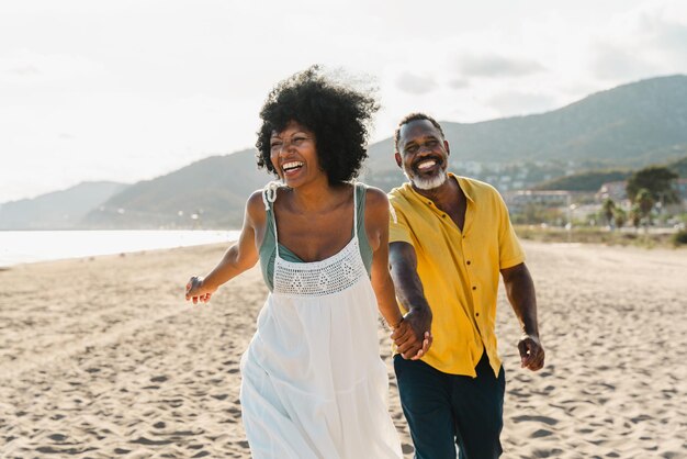 Beautiful mature black couple of lovers dating at the seaside