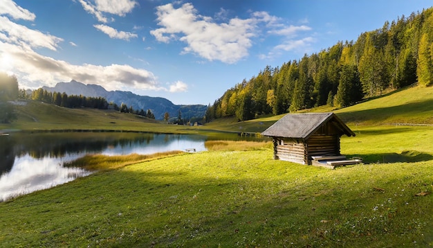 beautiful meadow with a wooden hut next to the lake