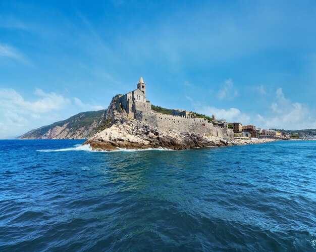 Beautiful medieval fisherman town of porto venere unesco heritage site view from sea near cinque terre liguria italy church chiesa di san pietro on rocky coast