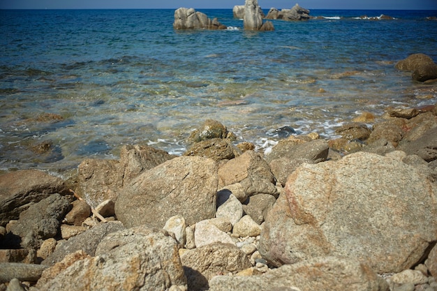 Beautiful Mediterranean beach typical of the coast of southern Sardinia taken over in summer
