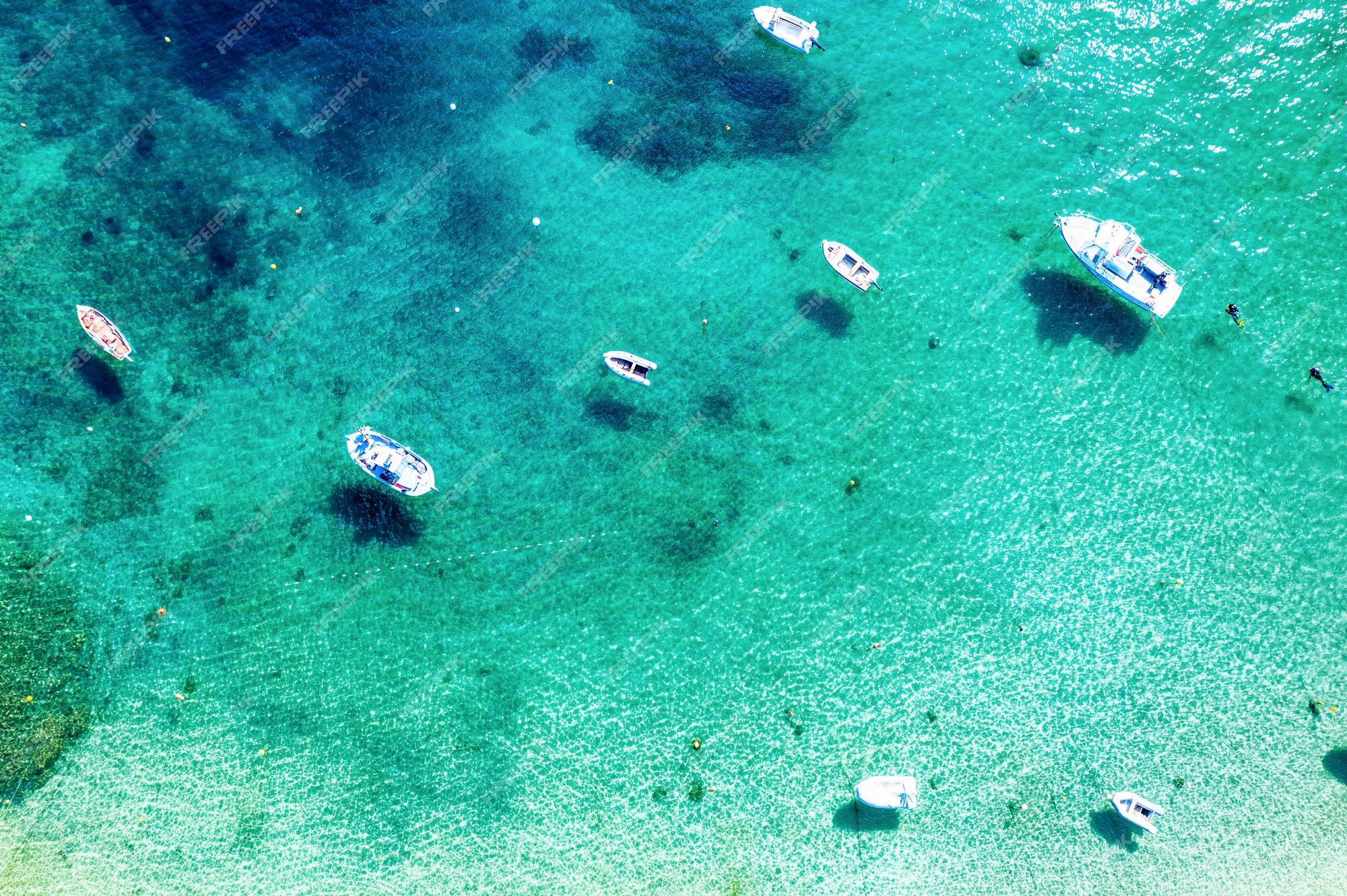 Premium Photo  Beautiful mediterranean sea in greece aerial abstract view  of tropical idyllic summer landscape with blue sea water and boats