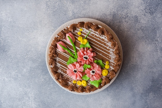 Beautiful meringue cake decorated with cream roses.