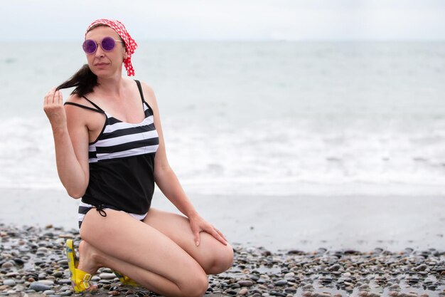 Beautiful middle aged woman on the beach