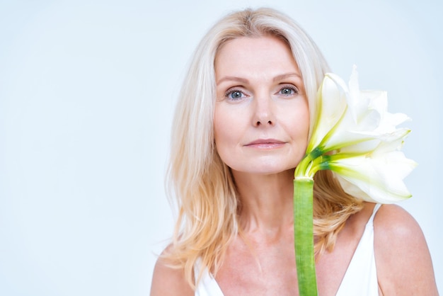 Beautiful middle aged woman posing in lingerie for a body positive and beauty photoshooting