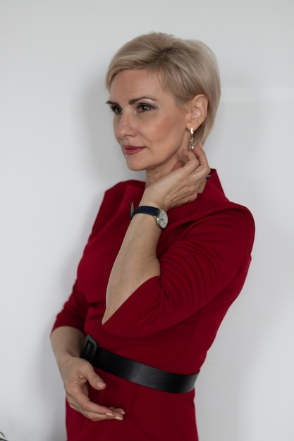 beautiful middleaged woman in red dress portrait