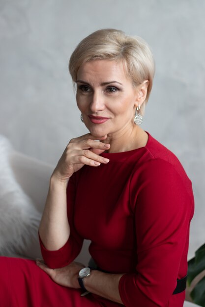 beautiful middleaged woman in red dress portrait