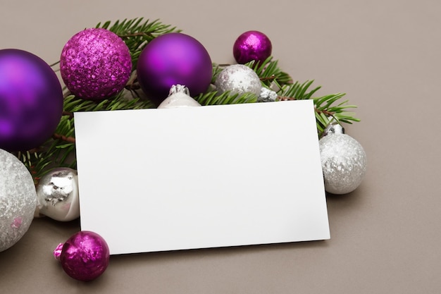 Beautiful mockup of a white card with Christmas ornaments on the side of the card