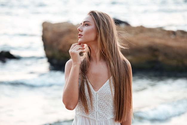 Beautiful model on the beach. in profile