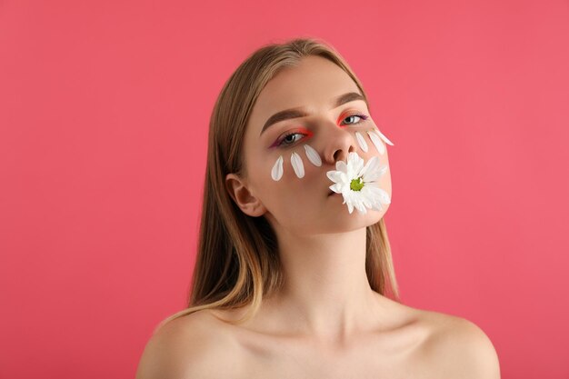 Beautiful model girl with petals