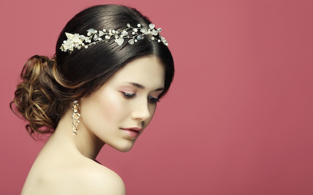 Beautiful model with bridal makeup and hairstyle